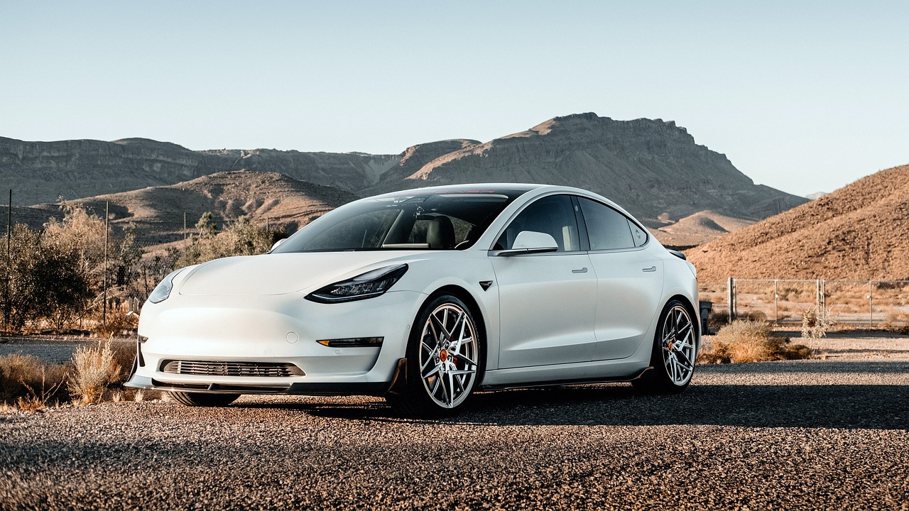 White Tesla car on an open road